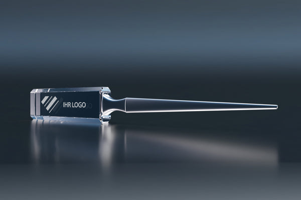 Premium crystal glass letter opener with an engraved logo on a dark background