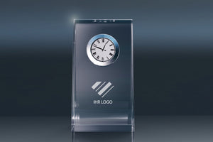 Elegant crystal glass desk clock with an engraving area for a company logo against a modern background