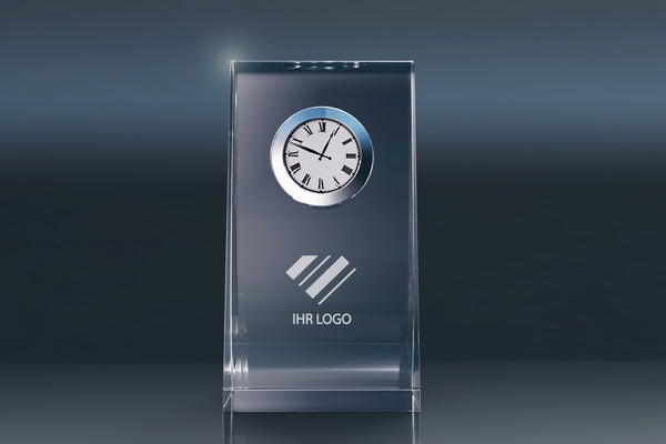 Elegant crystal glass desk clock with an engraving area for a company logo against a modern background