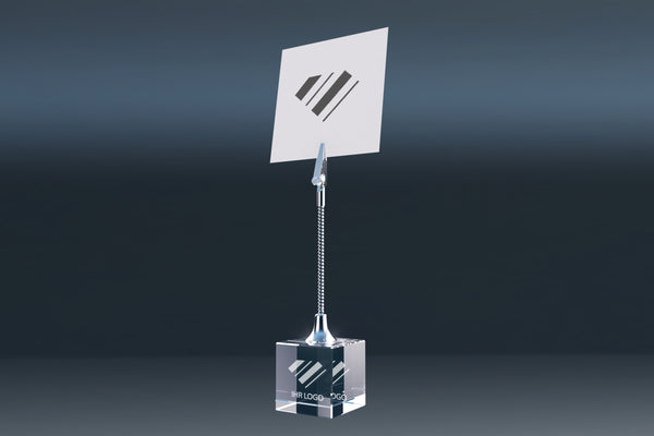 Elegant engraved crystal glass memo holder with wire clip against a dark background