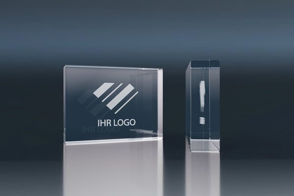 Rectangular crystal glass promotional block with an engraved logo and modern design
