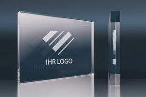 Rectangular crystal glass promotional item with an engraved logo on a glossy background