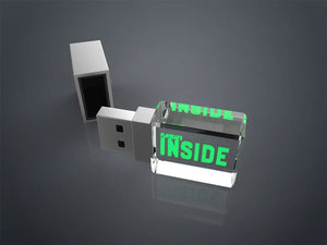 Square engraved crystal glass USB drive with its cap removed on a grey background